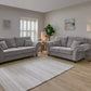 Light gray upholstered sofa set in modern living room.