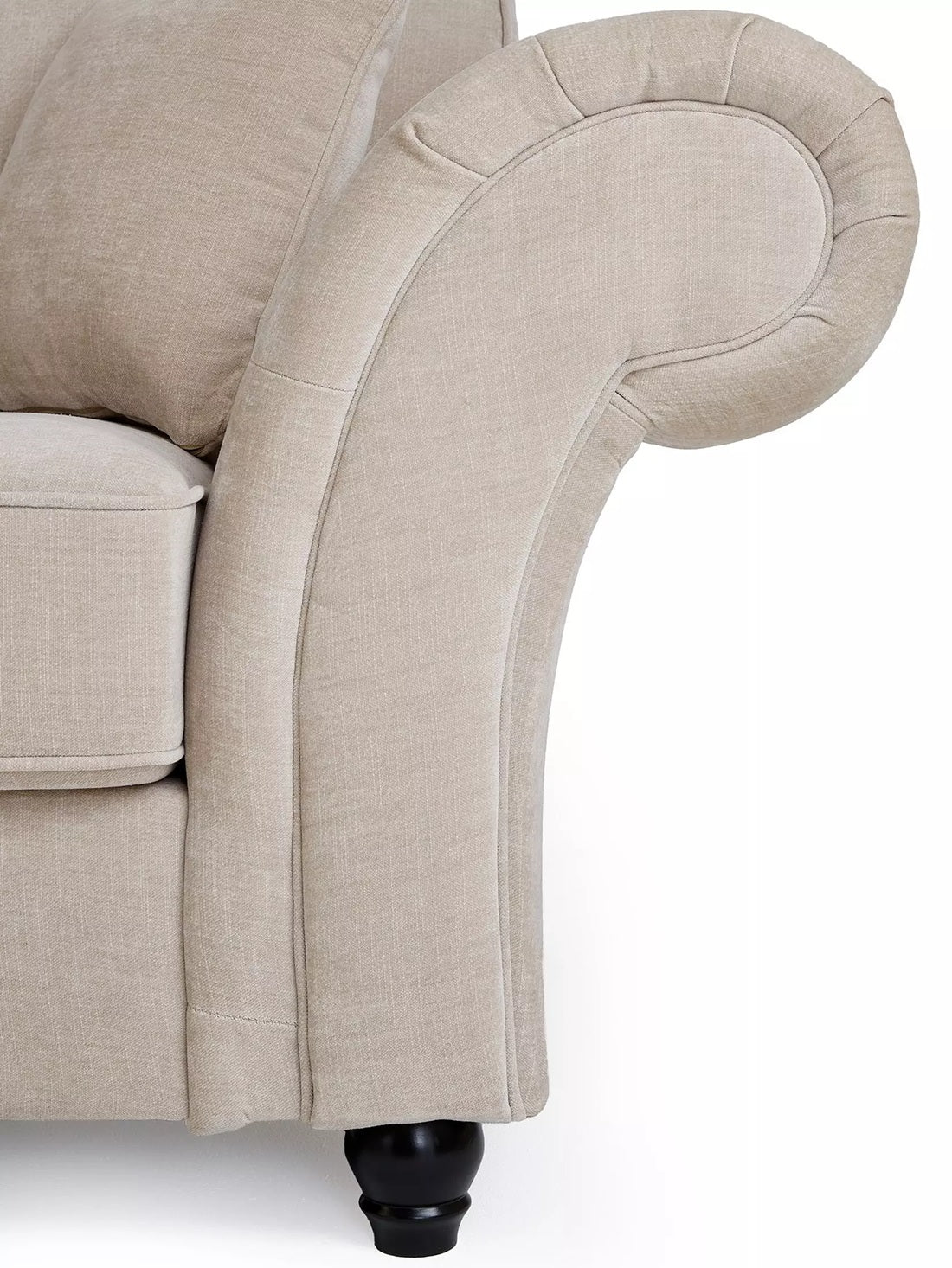 Close-up of a beige upholstered chair